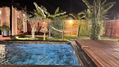 a swimming pool in a backyard at night at Loft Black Sapanca in Sapanca