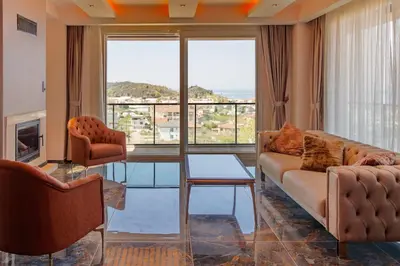a living room with a couch and two chairs at Comfort 4 bedroom villa yalova see view in Termal