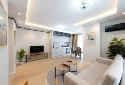 a living room with a couch and a table at Mayer Skycon Residence in Beşiktaş 2 in Istanbul