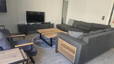 a living room with a couch and a table at City Center Suite in Istanbul