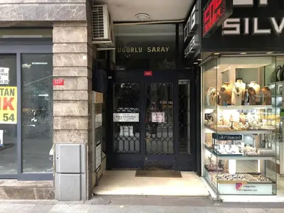 a store front with a black door on a city street at City Center Suite in Istanbul