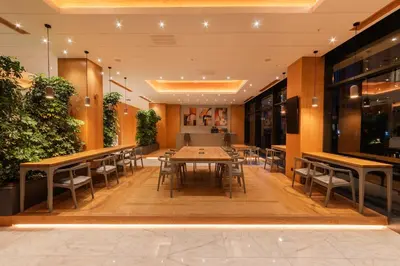 a dining room with tables and chairs and plants at Meroddi Beyoğlu Residence in Istanbul