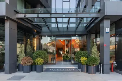 an entrance to a building with potted plants at Meroddi Beyoğlu Residence in Istanbul