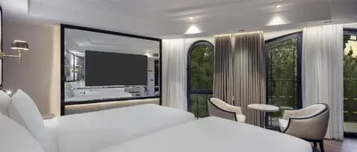 a bedroom with a white bed and a large window at The Ritus Hotel Istanbul Sultanahmet, Tapestry Collection by Hilton in Istanbul