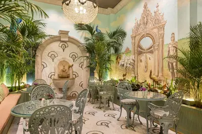 a restaurant with tables and chairs and a mural at The Ritus Hotel Istanbul Sultanahmet, Tapestry Collection by Hilton in Istanbul