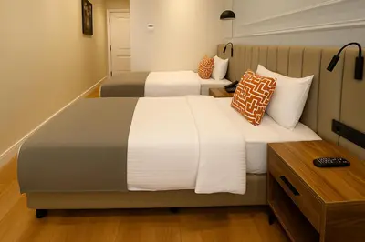 two beds in a hotel room with at Center Port Hotel Karaköy in Istanbul