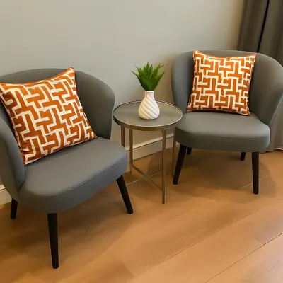 two chairs and a table with a vase in a room at Center Port Hotel Karaköy in Istanbul