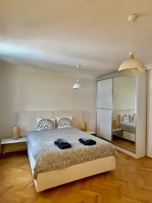 a bedroom with a large bed and a mirror at Deluxe Duplex in city center with 210 degrees Bosphorus viewed in Istanbul