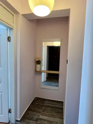 a hallway with a mirror and a window at Deluxe Duplex in city center with 210 degrees Bosphorus viewed in Istanbul