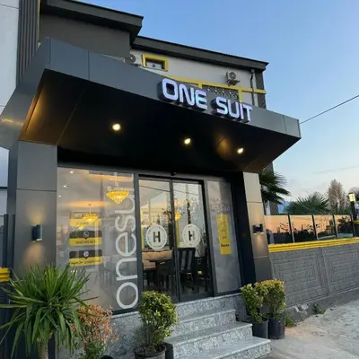 a restaurant with a one cut sign on the front of it at One Suit in Kartepe