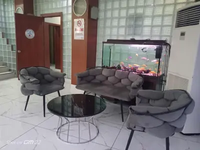 a room with two chairs and a fish tank at City Light Otel in Istanbul