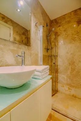 a bathroom with a sink and a shower at Istiklal Nil Suites in Istanbul