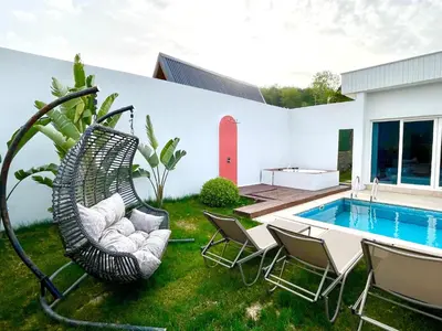 a patio with chairs and a swimming pool at Sakarya Sapanca Memnuniye de 2 oda 1 salon Özel Havuzlu , Muhafazakar , Şömineli , Jakuzili 6 Kişilik Tatil Villası in Sapanca