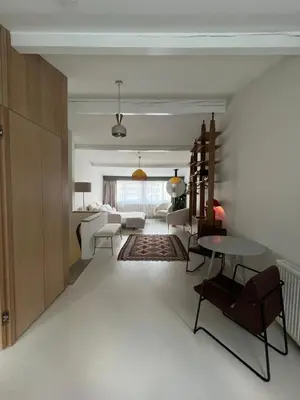 a living room with a couch and a table and chairs at Lobby No23 in Istanbul