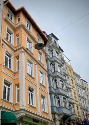 a building with a street light in front of it at Ozkaya Apartments Galata in Istanbul