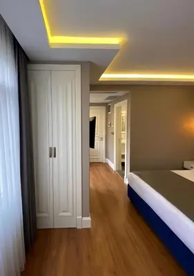 a bedroom with a bed and a ceiling at Ozkaya Apartments Galata in Istanbul
