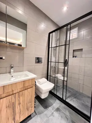 a bathroom with a toilet and a sink and a shower at The Bail Hotel in Istanbul