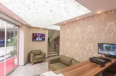 an office with a desk and a tv on a ceiling at Best Fulya Suites in Istanbul