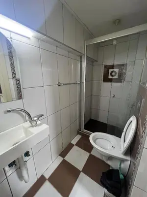 a bathroom with a toilet and a sink at Taksim White Mansion Hotel in Istanbul