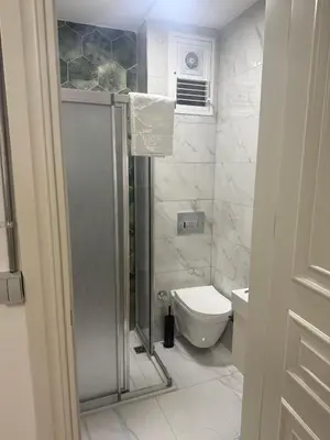 a bathroom with a shower and a toilet at Neo Konak in Istanbul