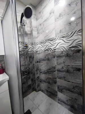 a shower with a glass door in a bathroom at Grafen Hotel in Istanbul