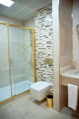 a bathroom with a toilet and a shower and a sink at Arden City Hotel-Special Category in Istanbul