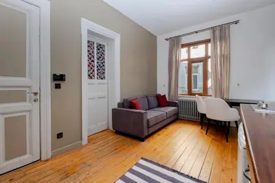 a living room with a couch and a table at Exclusive House with 2 Apartments including 4 Bedrooms and 4 Bathrooms in Total in Istanbul