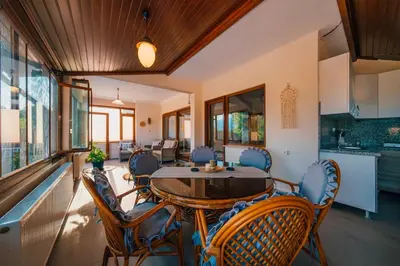 a dining room with a table and chairs at Sepetçi Lakehouse Heated Pool in Kartepe