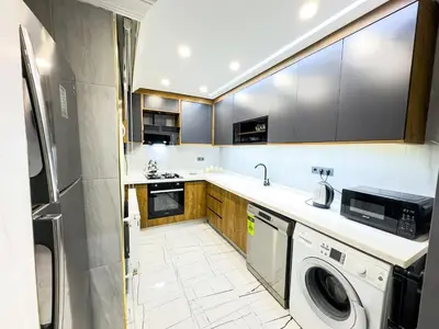 a kitchen with a washer and dryer in it at Dream Apartment in Sheshli 5 4 1 in Istanbul