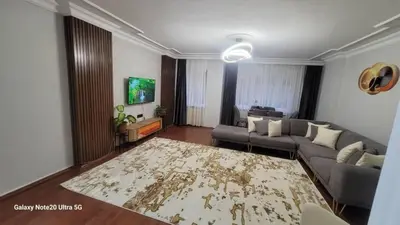 a living room with a couch and a rug at شقه الأحلام بمنطقة شيشلى ثلاث غرف وصالون in Istanbul