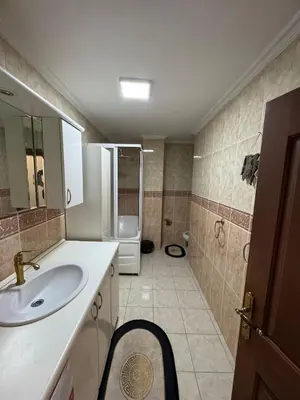 a bathroom with a sink and a shower at شقه الأحلام بمنطقة شيشلى ثلاث غرف وصالون in Istanbul