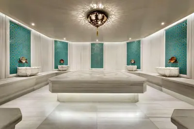 a large room with a chandelier on the ceiling at Ramada by Wyndham Gemli̇k in Gemlik