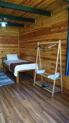 a log cabin with a bed and a swing at Hilltop Bungalov Sapanca 1 in Sapanca