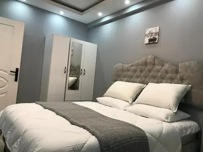 a bedroom with a large bed with white sheets and pillows at Nexus By Taksim Hotel in Istanbul