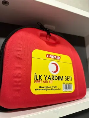 a red bag on a shelf with a tag on it at Modern 2Bedroom Apt in Şişli in Istanbul