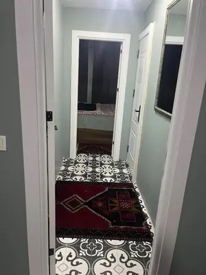 a small hallway with a door leading to a bedroom at Murat bey konağı in Istanbul