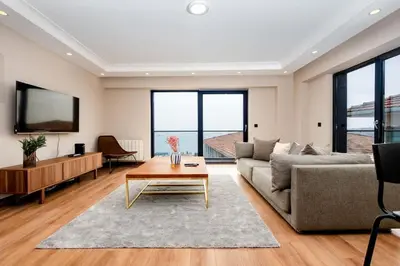 a living room with a couch and a table at Luxury Stay with Panoramic Bosphorus View in Istanbul