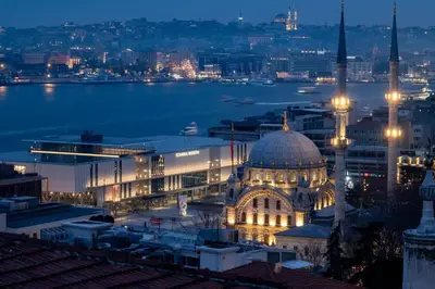 a view of a city at night with a mosque at Luxury Stay with Panoramic Bosphorus View in Istanbul