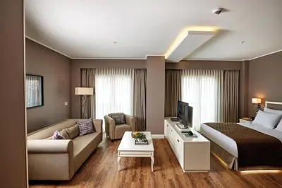 a hotel room with a bed and a living room at Renata Boutique Hotel Sisli in Istanbul