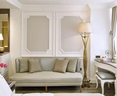 a living room with a couch and a table at Mirrors Hotel İstanbul Taksim City Center in Istanbul