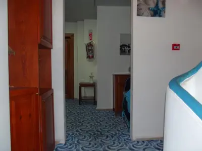 a hallway of a room with a room with a unintention at Mavi Inci Park Otel in Erdek