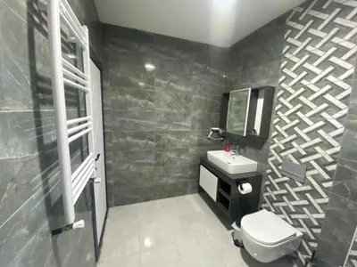 a bathroom with a toilet and a sink and a mirror at Ağva Capella Hideaway Hotel in Sile