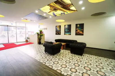 a living room with a couch and chairs and a rug at Polo Suit Otel in Avcılar