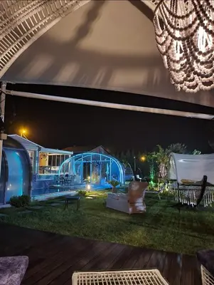 a blue tent in a yard at night at villa SM in Çatalca