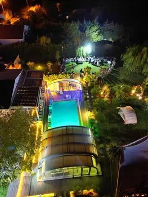 an overhead view of a swimming pool at night at villa SM in Çatalca