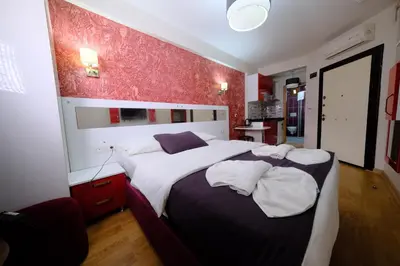 a bedroom with a large bed with two pillows at Taksim green suite in Istanbul