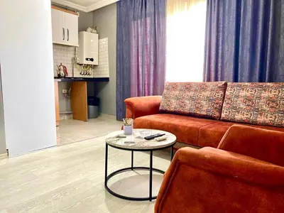 a living room with a couch and a table at My King Suit in Istanbul