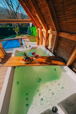 a hot tub in the middle of a house at Mert Bungalov-Yıldız Evi in Sapanca