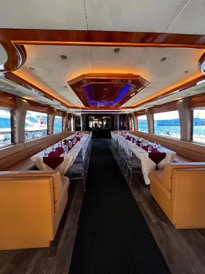 a dining room with chairs and tables in a boat at Den Den İstanbul in Istanbul