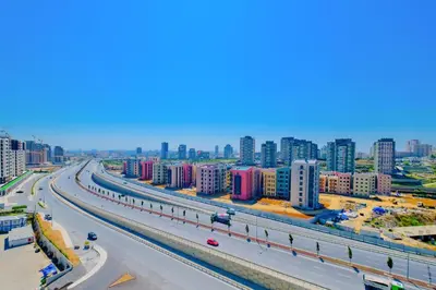 a highway in a city with tall buildings at Modern Furnished Apartments in Istanbul Basaksehir By Iradah Gayrimenkul in Basaksehir